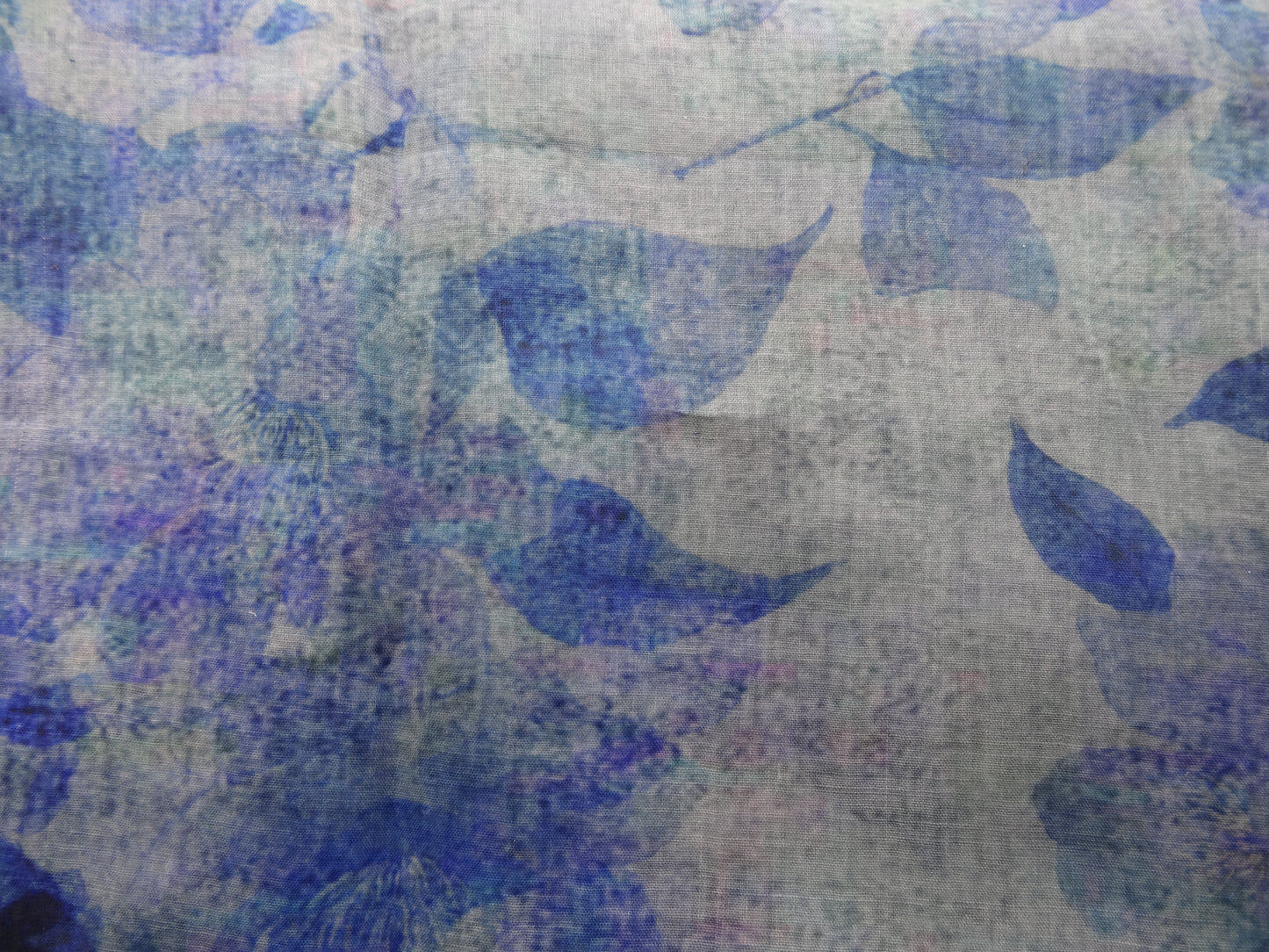 Photo of leafy floral digital print on lightweight ramie fabric remnant in blue