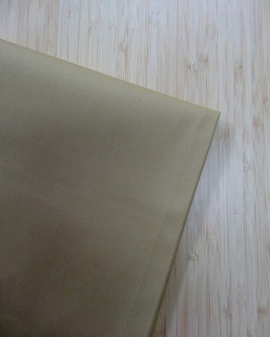 Cotton Twill fabric great for coating. Photographed from above on a wooden table