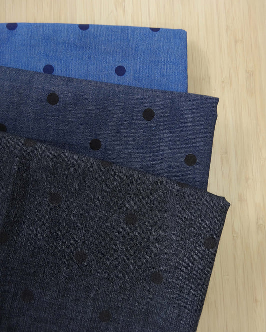 Three shades of denim fabric with polka dot spot print