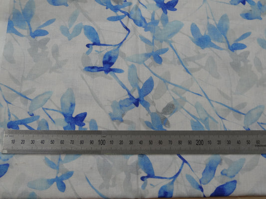 white Fabric with blue floral pattern and a ruler for scale 